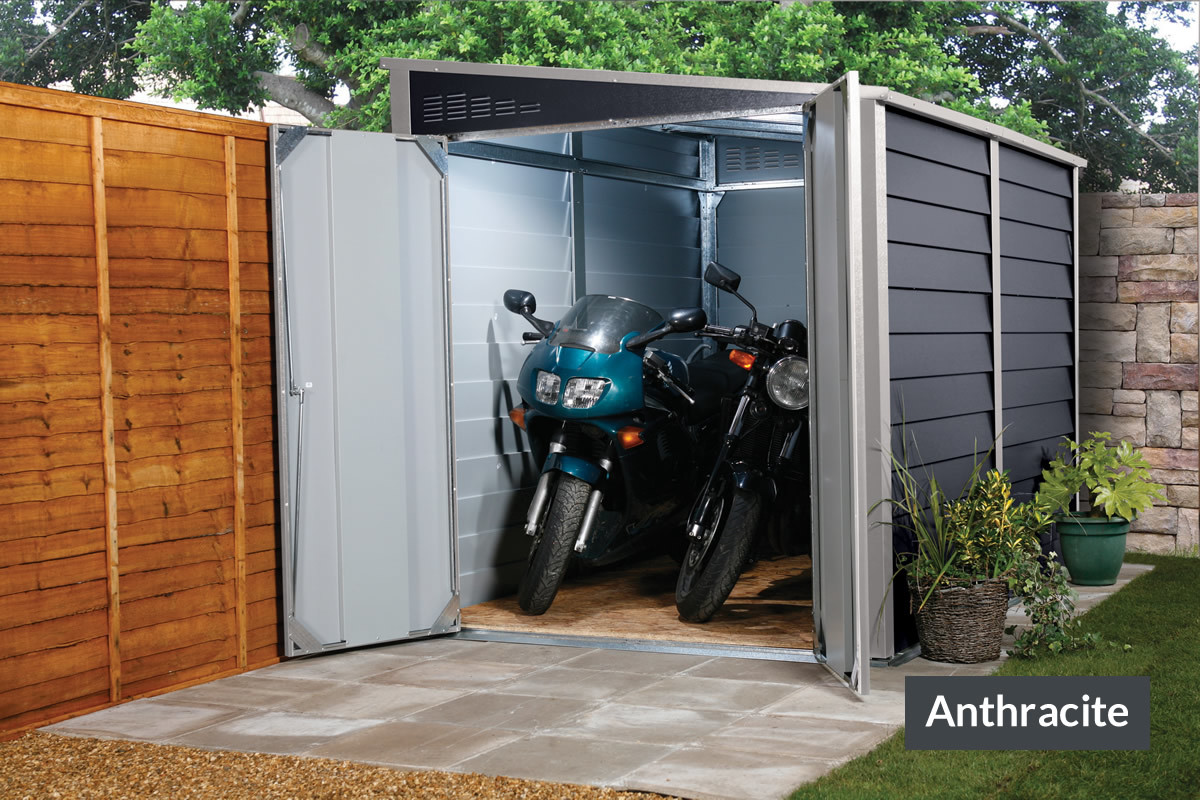 two motorcycles inside an anthracite colored shed
